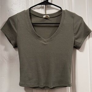 Green v-neck ribbed crop top.